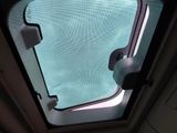 a view of the sky through the window of a train
