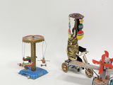 three small toys that are sitting on a white surface