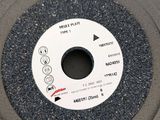 a picture of a grinding wheel on a table