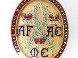 une image représentant un insigne sur lequel figurent les lettres « aff jac »