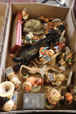 a box full of figurines sitting on a table
