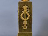 an image of a golden clock with a lion on top of it