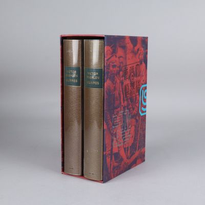 the two books are in a red box on a white surface