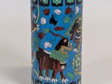 a blue vase with a picture of a horse and a bird on it