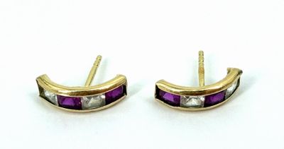 two tone gold and purple earrings with diamonds on them
