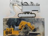 a picture of a construction vehicle and a bulldozer in a box