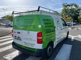 a van that is parked on the side of the road