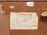 a piece of paper taped to the side of a wooden cabinet
