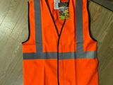 an orange safety vest on the floor in a store