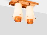 two lights that are on the ceiling in the room