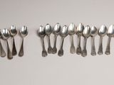 a lot of silver spoons and spoon spoons on a table