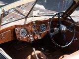 a dashboard and steering wheel of a vintage car