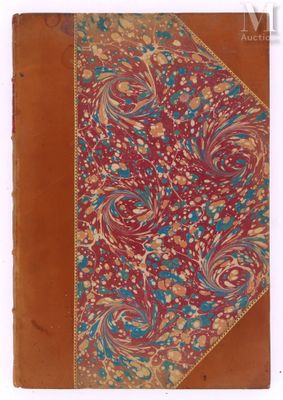 an old book with a floral design on it