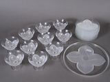 a lot of empty plastic cups and a bowl on the table