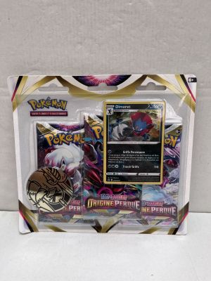 a close up of a box of pokemon cards on a white surface