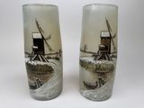 two tall glass vases with windmills on them