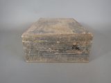 an old wooden box that is sitting on a table