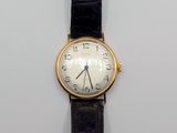a watch that is sitting on a white surface