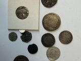 a lot of coins that are sitting on a table