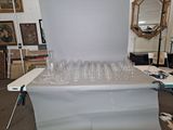 a table with a bunch of empty wine glasses on it