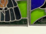 two stained glass panels depicting a woman and a man in a tuxedo