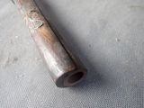 a baseball bat that is laying on a table