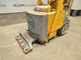 an image of a forklift truck parked in front of a building