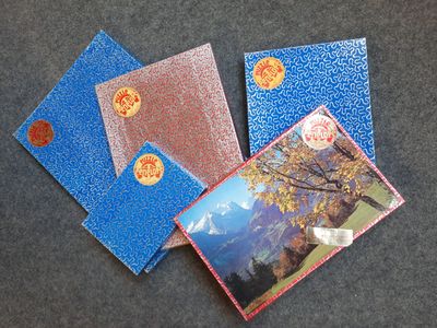 four cards with a picture of a woman and a tree on them