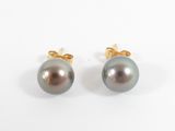 a pair of black pearl earrings on a white background