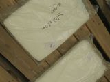 several boxes of cheese sitting on top of a pallet in a warehouse