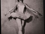 black and white photograph of a woman in a tutu posing for a picture