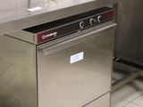 a stainless steel dishwasher in the middle of a kitchen