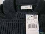 a label on a sweater that says i ming