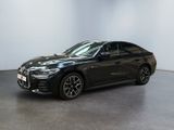 a black bmw x4 parked in a white room