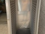 an image of a stainless steel freezer with a door open