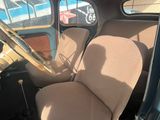 a view of the inside of a car from the driver ' s seat