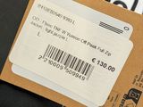 a person holding a ticket with a barcode on it
