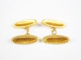 une paire de boutons de manchette en or de forme ovale