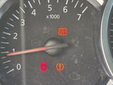 a close up of a car dashboard with a speedometer