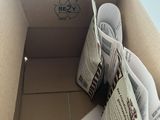a cardboard box with a newspaper inside of it