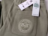 men ' s khaki green pants with a tag on the side