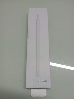 a white box with a pencil in it sitting on a table