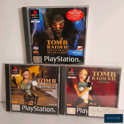 three video games are sitting on a table next to each other