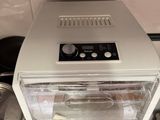 a toaster oven sitting on top of a stove