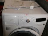 a washer and dryer sitting next to each other in a room