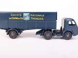 a toy truck with a trailer attached to it ' s back