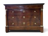 an antique chest of drawers with brass handles and a marble top