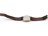 an image of a wrist watch with a brown leather band