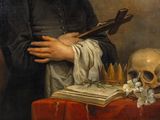 portrait of a man with a skull and a book