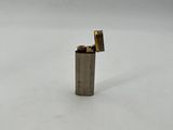 a lighter that is sitting in the snow on the ground